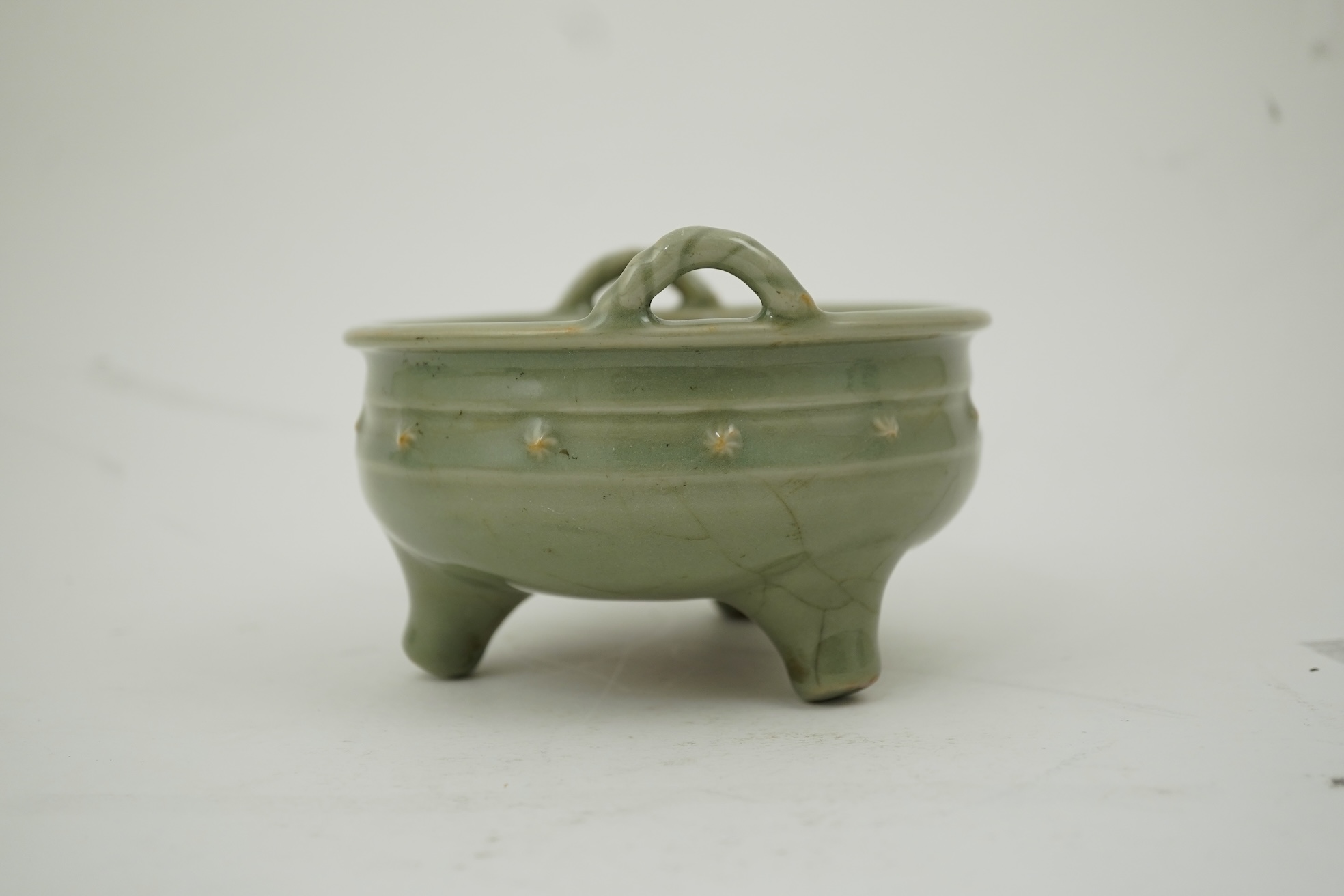 A Chinese Longquan celadon crackle glazed tripod censer, Ming dynasty or later